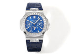 Patek Philippe wristwatch with blue dial, silver case, diamond bezel, and dark blue leather strap