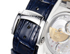 Patek Philippe watch strap close-up with blue leather, metal buckle and embossed texture