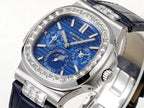 Patek Philippe watch angled view with blue dial and silver hands over diamond bezel