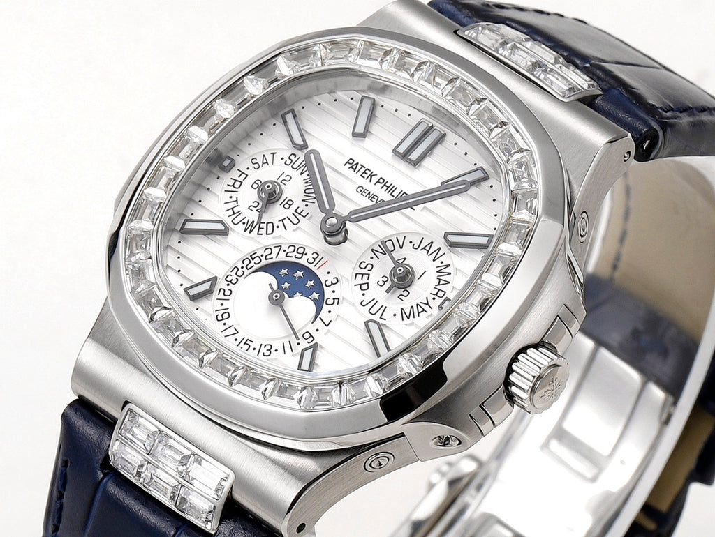 Patek Philippe watch close-up of silver dial and diamond bezel with blue strap.