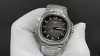 Patek Philippe wristwatch with black dial, diamond bezel, and steel bracelet links
