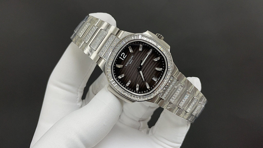 Patek Philippe wristwatch angled view with black dial, diamond bezel, and steel bracelet