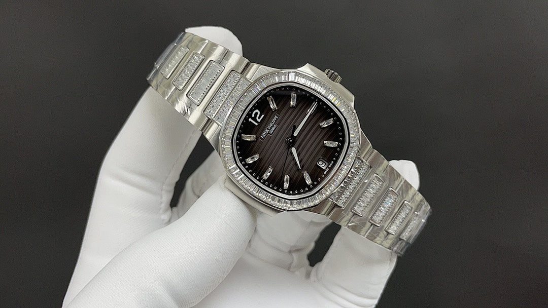 Patek Philippe wristwatch angled view with black dial, diamond bezel, and steel bracelet