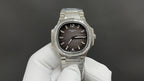 Patek Philippe wristwatch front view with black dial and diamond-set bezel