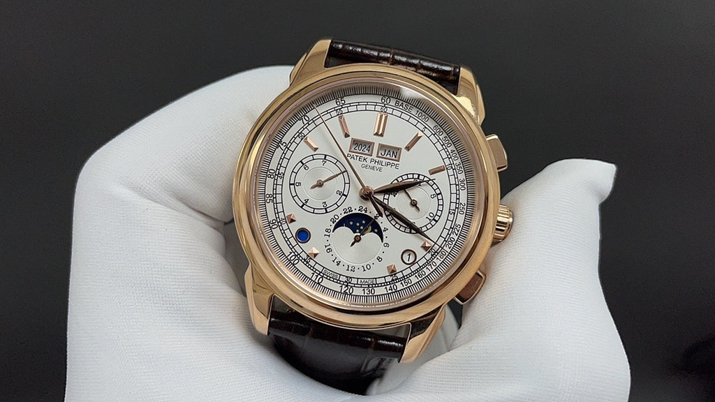 Gold-tone luxury wristwatch with white dial, subdials, and brown leather strap