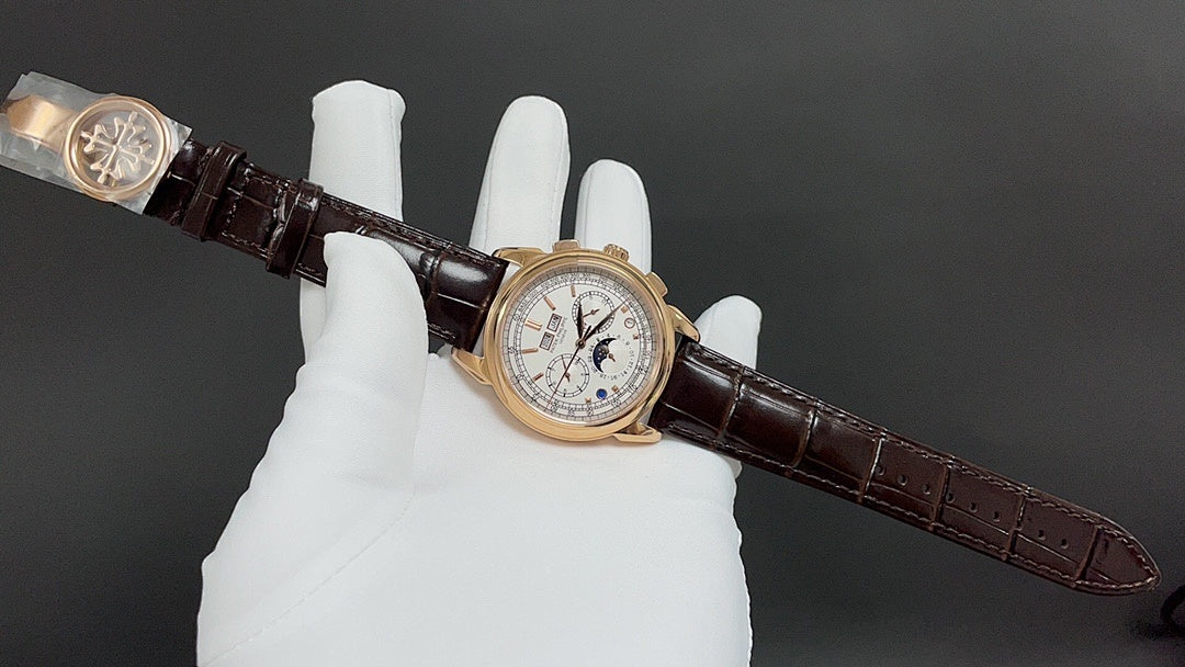Gold-tone luxury wristwatch on brown leather strap, angled view with white dial