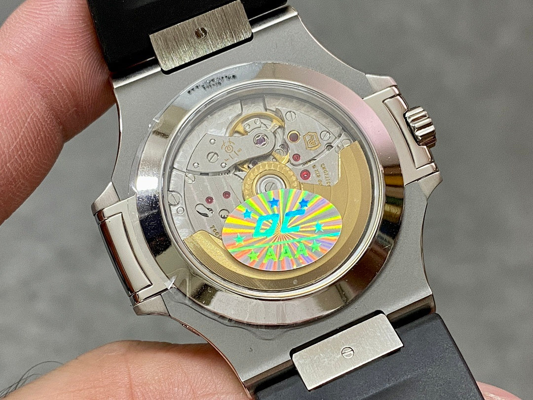 Patek Philippe watch caseback showing mechanical movement through clear back