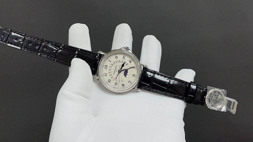 Wristwatch on black leather strap with clasp and small round dial at center
