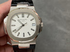 Patek Philippe watch showing white dial with black markers and black leather strap