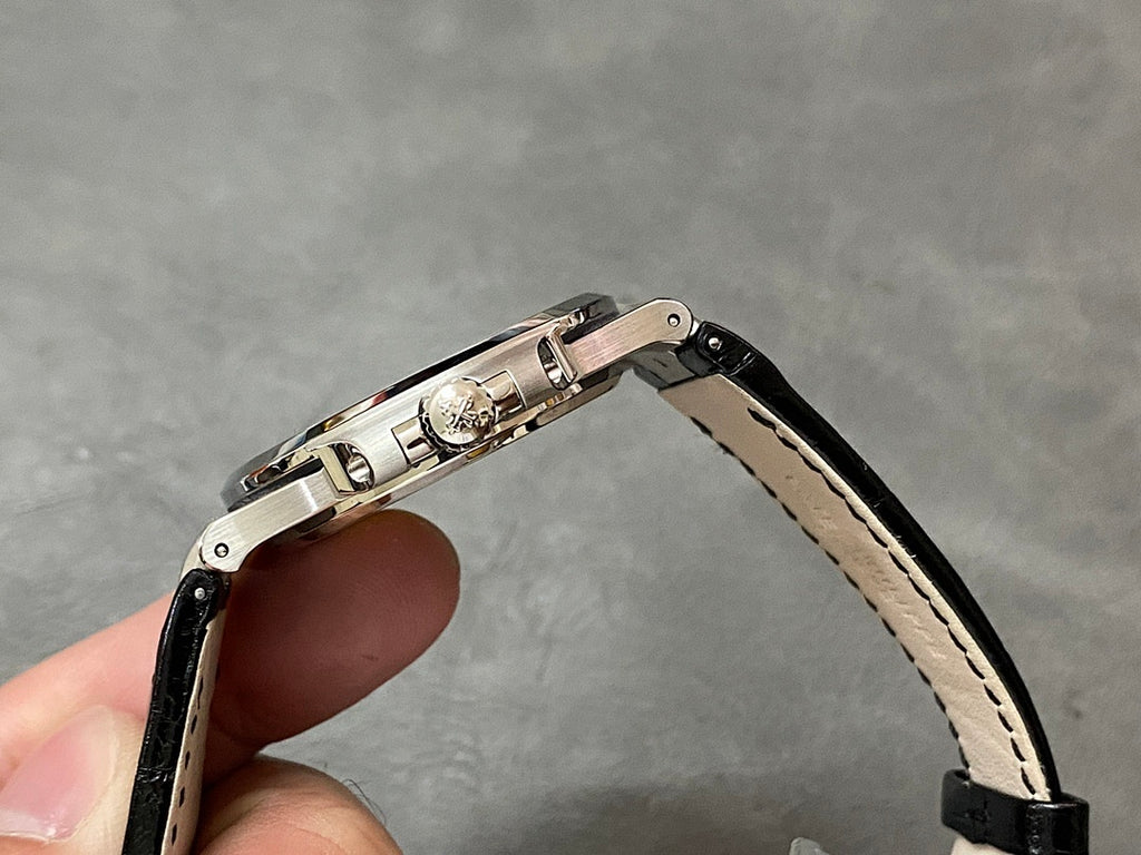 Patek Philippe watch on black leather strap with clasp and clasp hardware