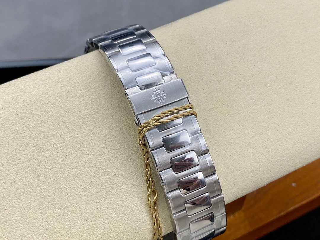 Stainless steel watch bracelet with two-tone gold rope detail across metal links