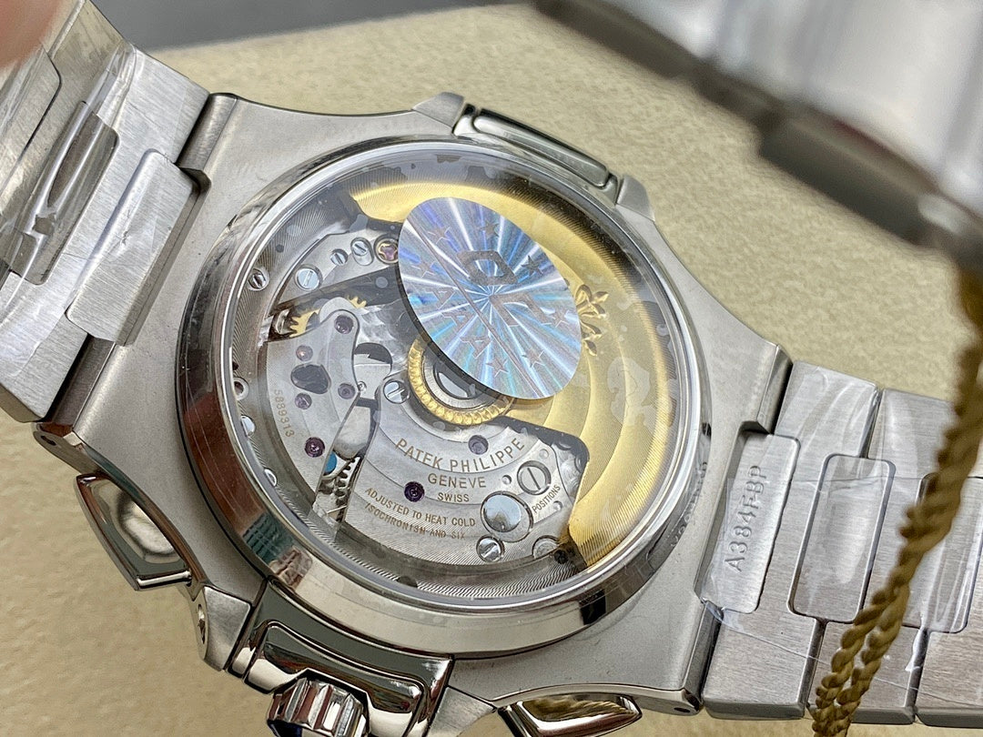 Stainless steel watch caseback with visible mechanical movement and balance wheel