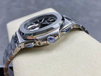 Stainless steel wristwatch with round case, crown detail, and dark dial with subdials