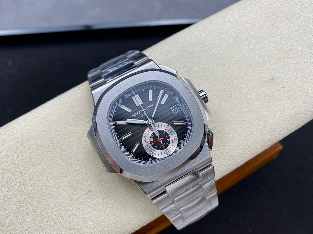 Stainless steel wristwatch with dark dial, subdials, and date window near 3 o'clock