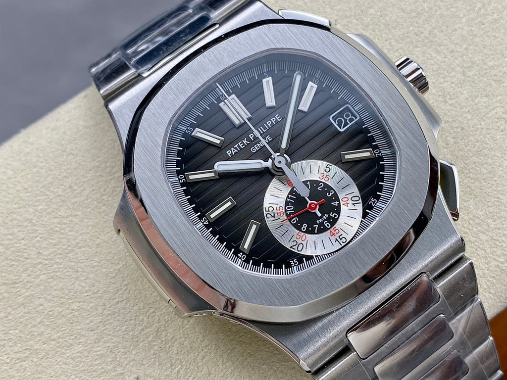 Stainless steel wristwatch with dark blue dial, raised bezel, baton hands, and subdial