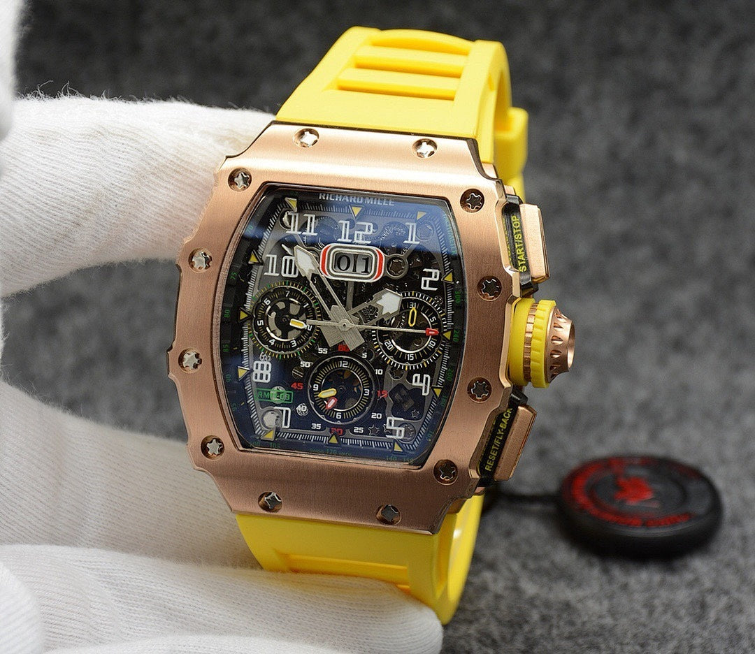Richard Mille watch with rose gold case, dark dial, and yellow rubber strap