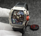 Richard Mille watch with silver case, black dial, and black rubber strap