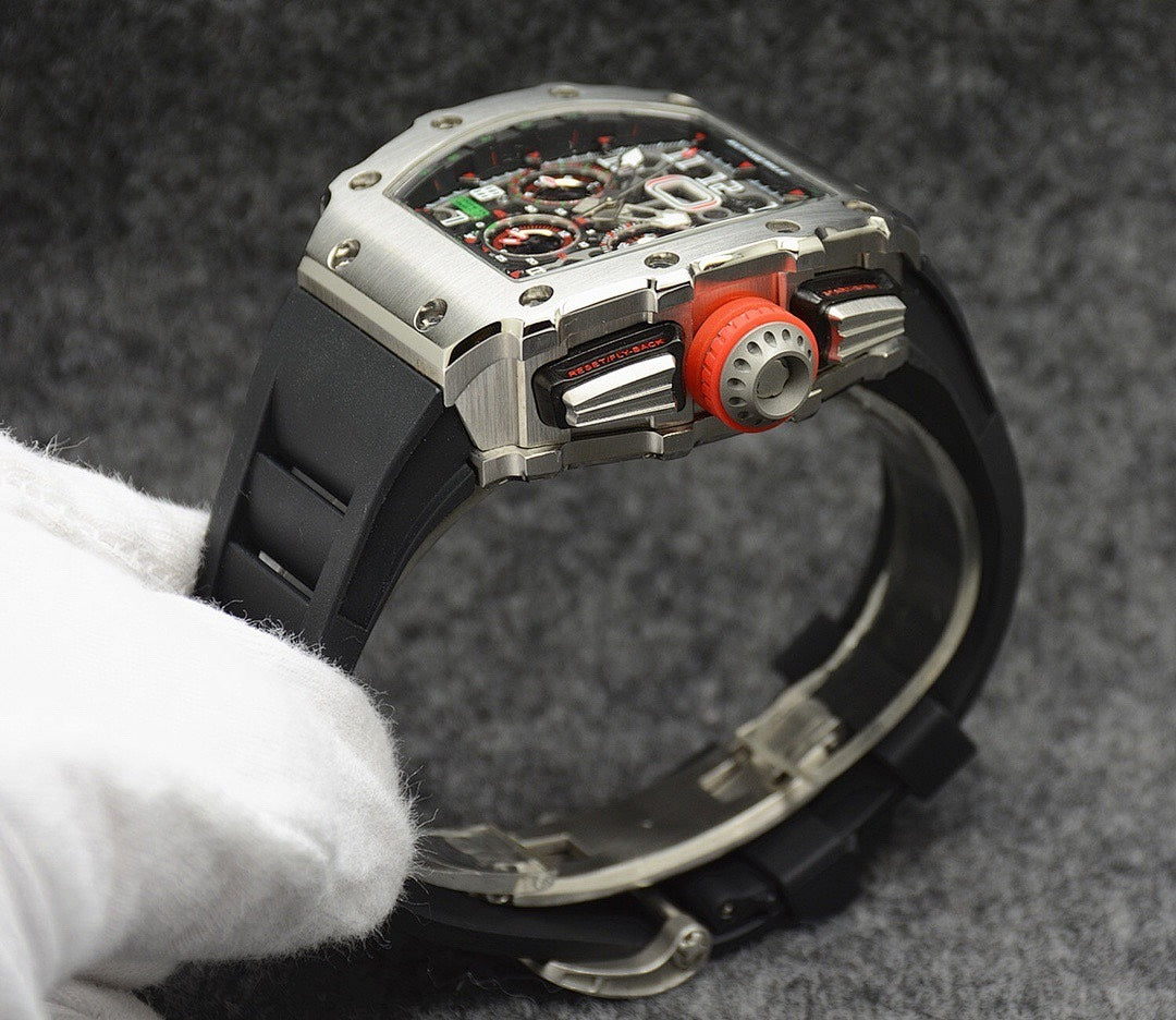 Richard Mille watch case back with silver finish and black rubber strap, red detail