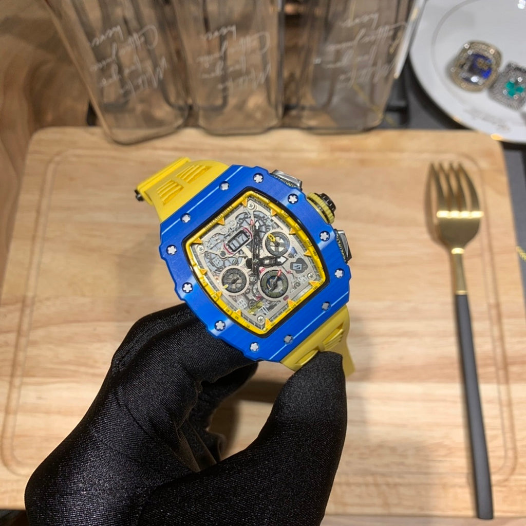 Richard Mille watch with blue case and yellow strap, silver openwork dial