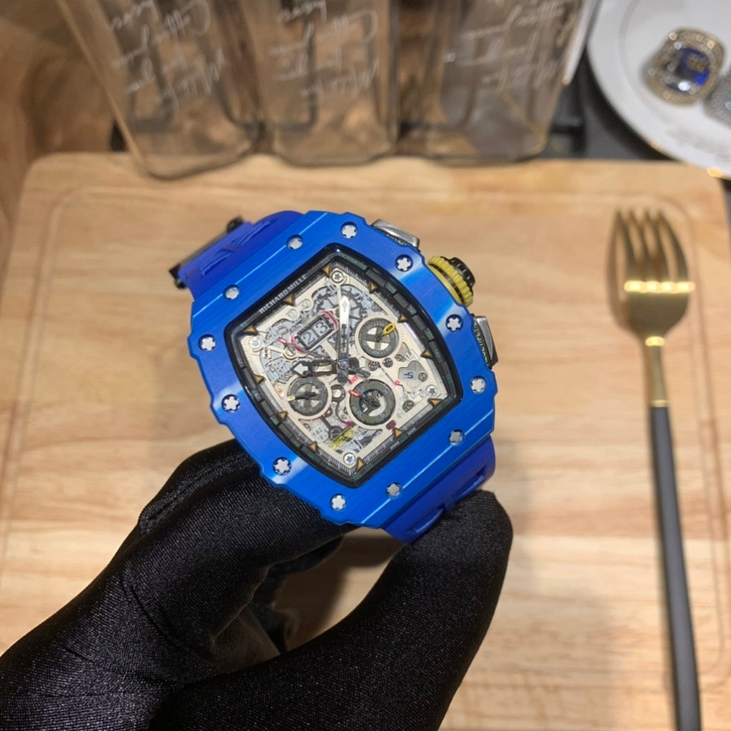 Richard Mille watch with blue case and black strap, skeleton dial detail