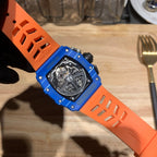 Richard Mille watch with blue case and orange perforated strap, skeleton dial