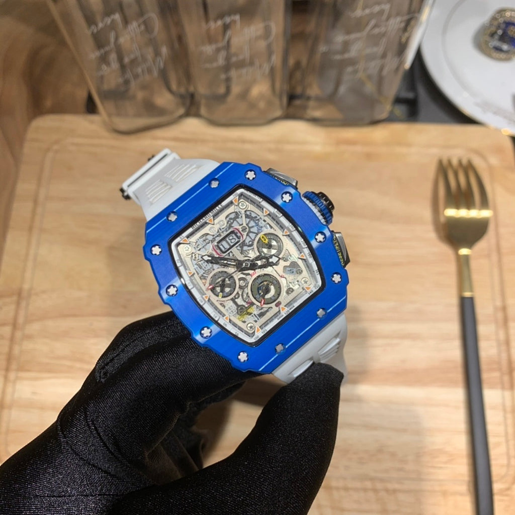 Richard Mille watch with blue case and white strap, openwork skeleton dial