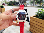 Richard Mille watch in hand, red rubber strap and white case with skeleton dial