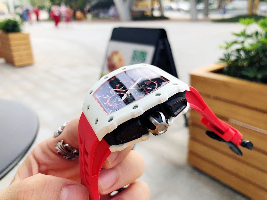 Richard Mille watch angled view, red rubber strap and white case with skeleton dial