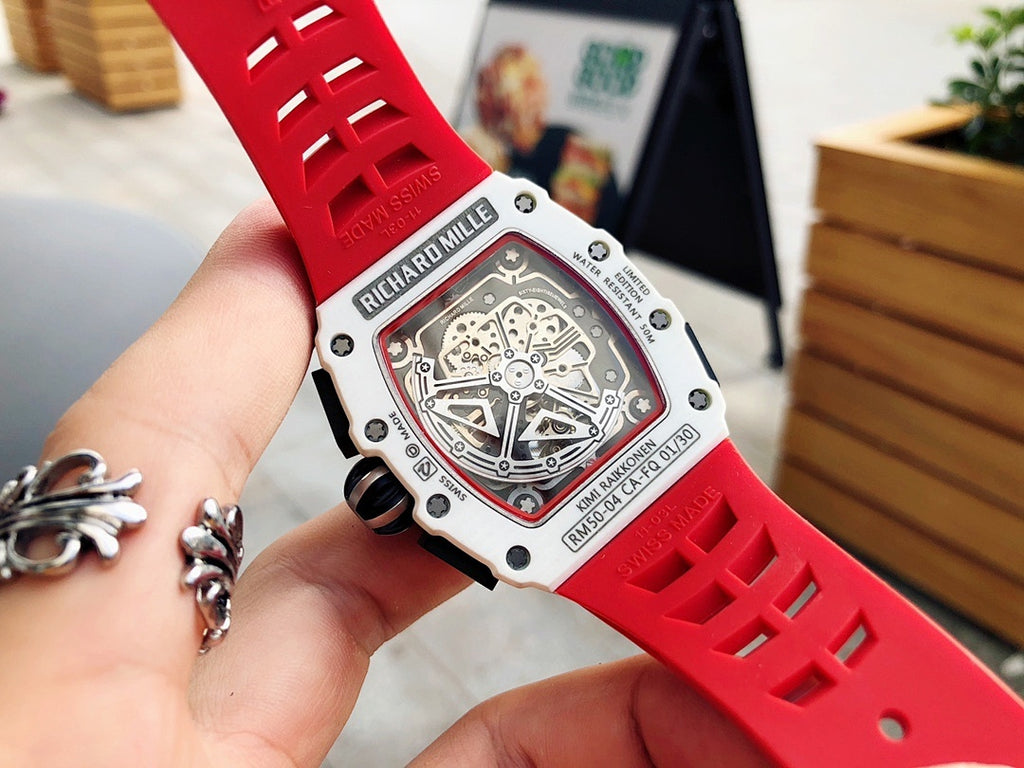 Richard Mille watch underside view, red rubber strap with engraved bracelet band