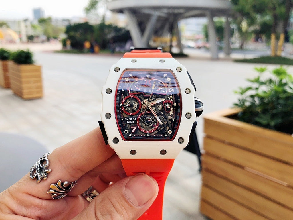 Richard Mille watch with white case and red rubber strap, skeleton dial visible