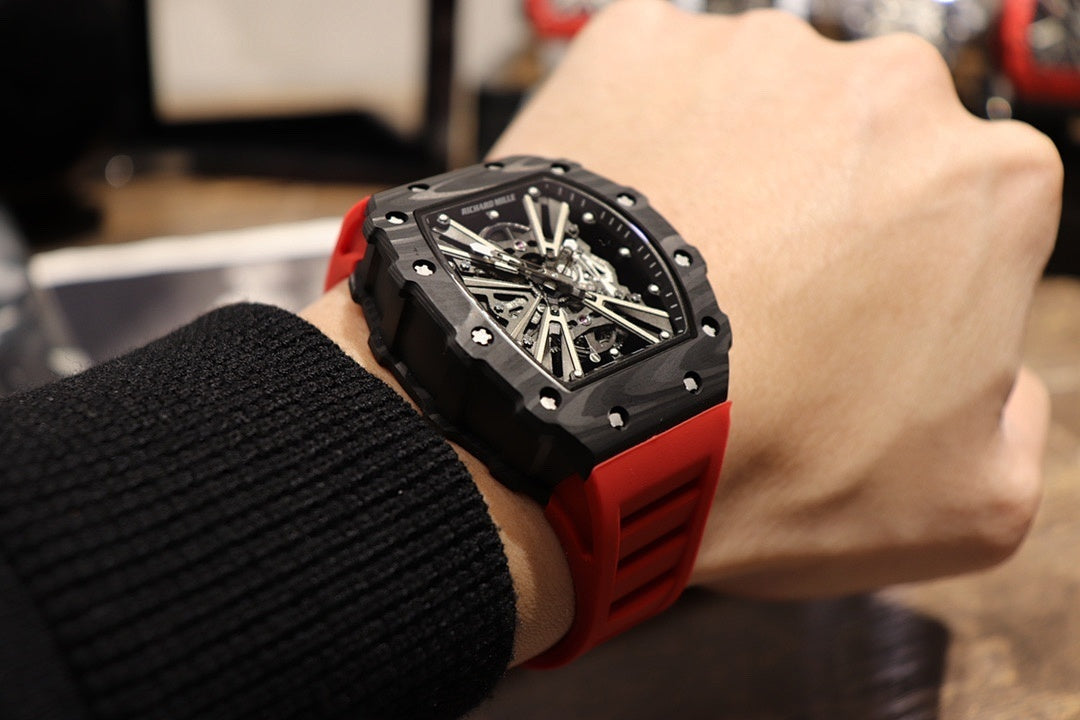 Richard Mille watch side view with black case and red strap cuff