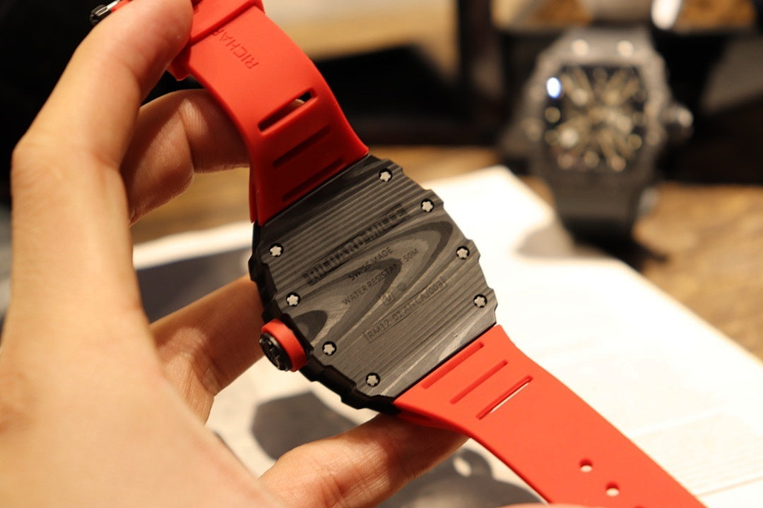 Richard Mille watch back view with gray textured case and red rubber band