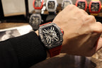 Richard Mille watch on wrist, black case with skeletal dial and red rubber strap