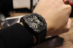 Richard Mille watch on wrist, three-quarter view of black skeleton dial and strap