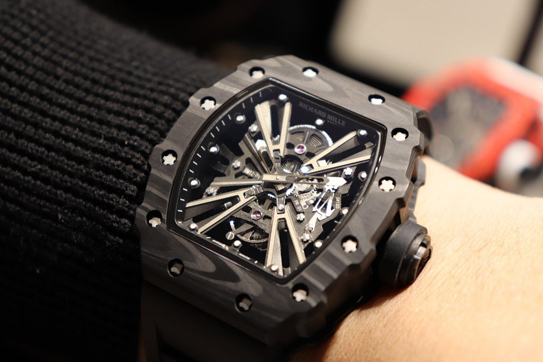 Richard Mille watch face close-up on wrist, black case with visible mechanical movement