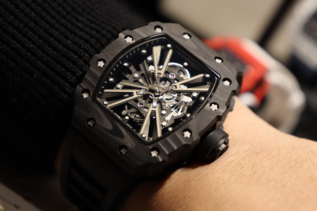 Richard Mille watch tilted view, black skeleton dial with exposed gears, black strap