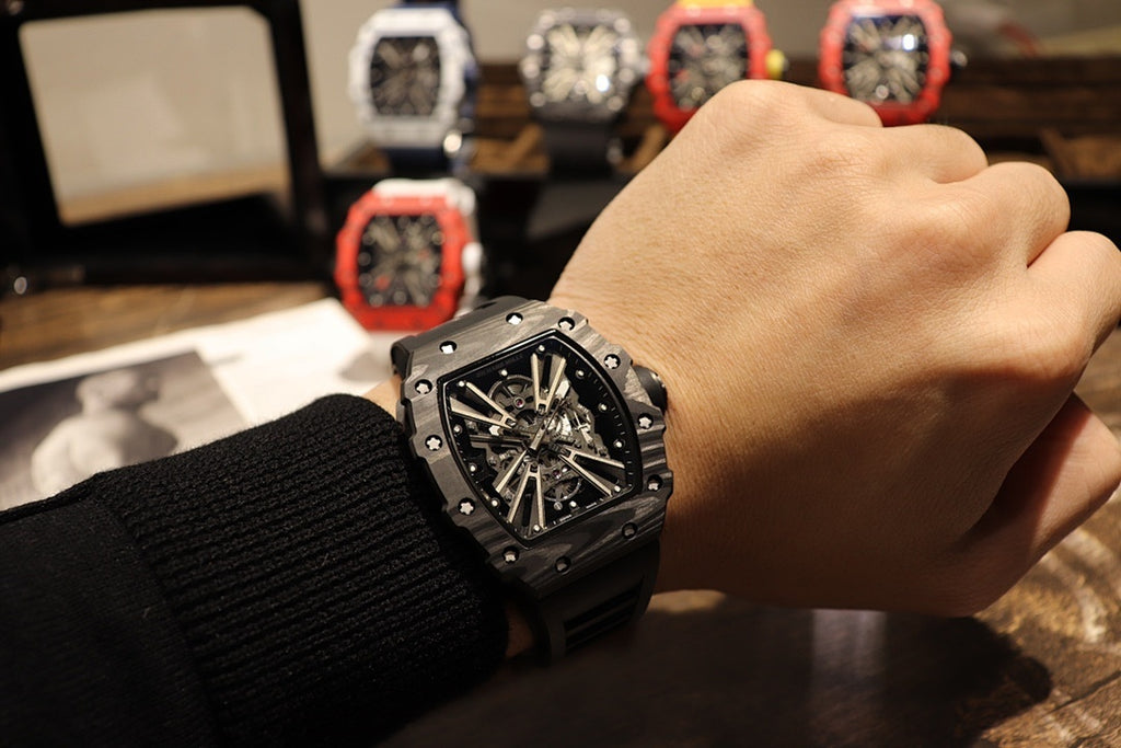 Richard Mille watch worn on wrist, black square skeleton dial with visible movement