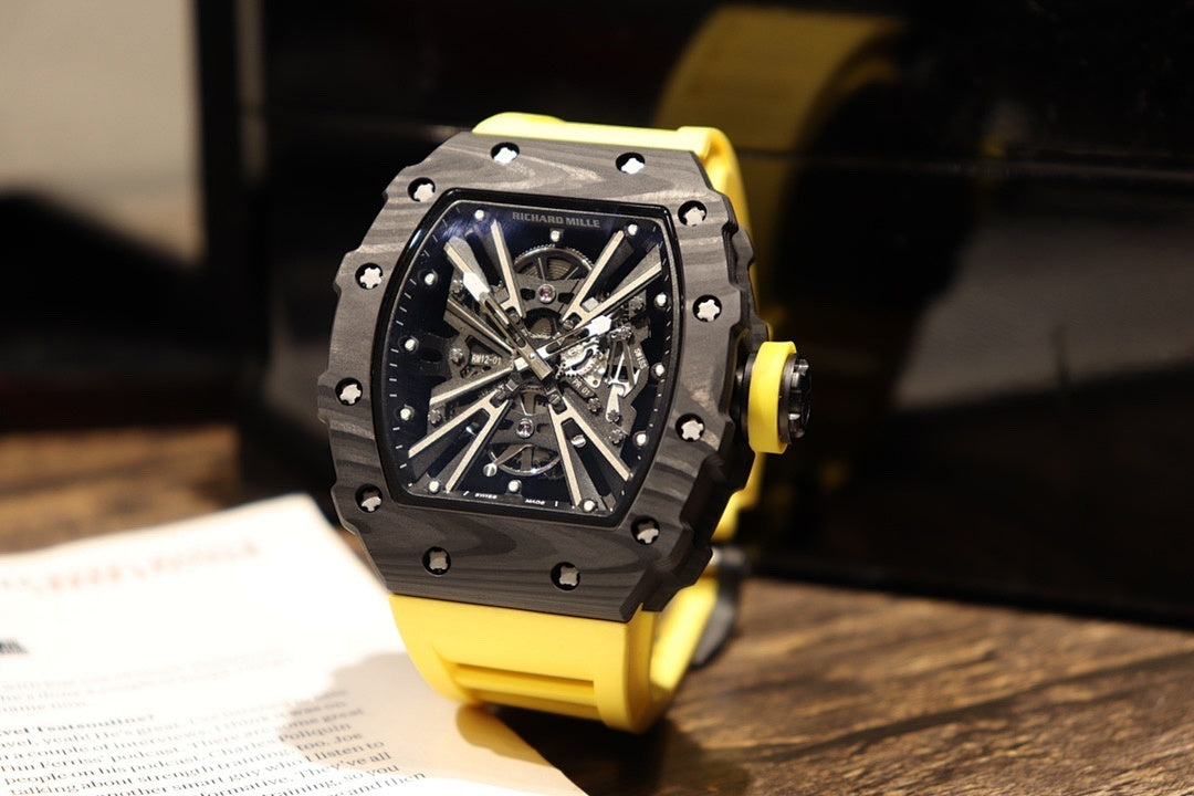 Skeleton sports watch with yellow silicone strap, black dial and metallic knurled case