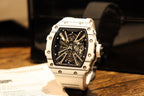 Skeleton sports watch with white silicone strap, white octagonal case, black dial