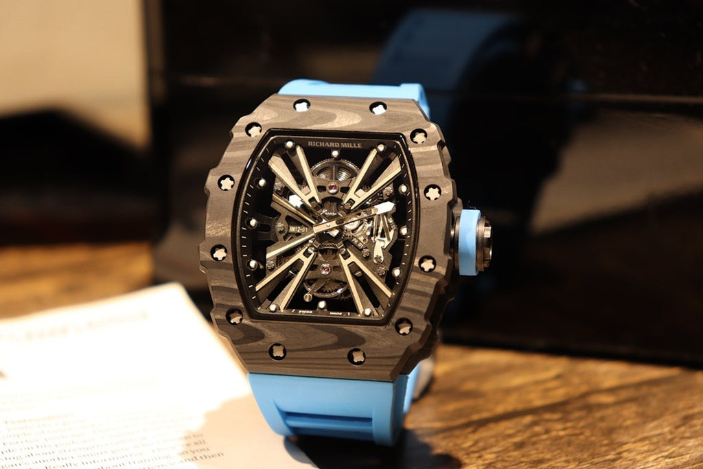 Skeleton sports watch with blue silicone strap, black dial and faceted octagonal case