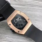 Richard Mille watch back view, rose-gold case, black rubber strap with screw details