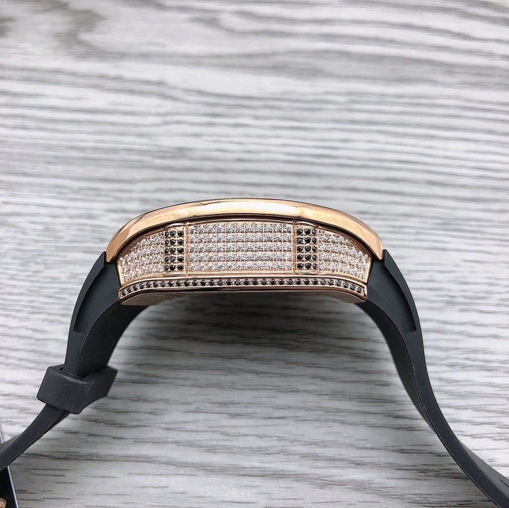 Richard Mille watch top view, rose-gold diamond bezel, black rubber strap