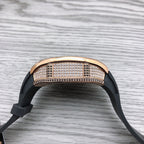 Richard Mille watch top view, rose-gold diamond bezel, black rubber strap
