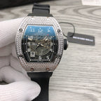 Richard Mille watch front view, silver jeweled bezel, black rubber strap, blue dial