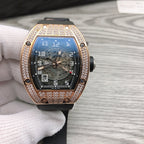 Richard Mille watch with rose-gold diamond bezel, black rubber strap, blue skeleton dial