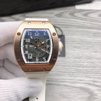 Richard Mille watch with gold-toned case, skeleton dial, and light strap.