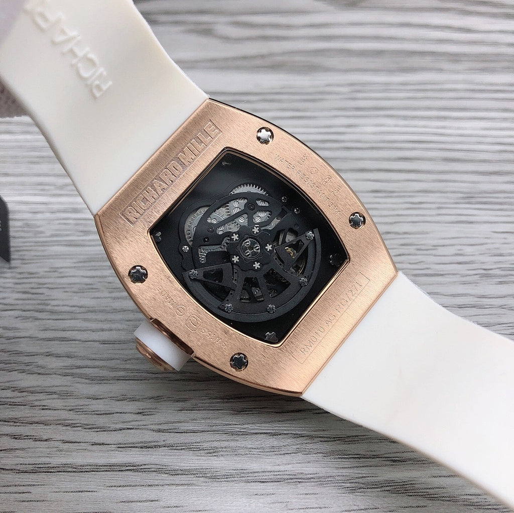 Richard Mille watch caseback on white rubber strap with black dial panel.