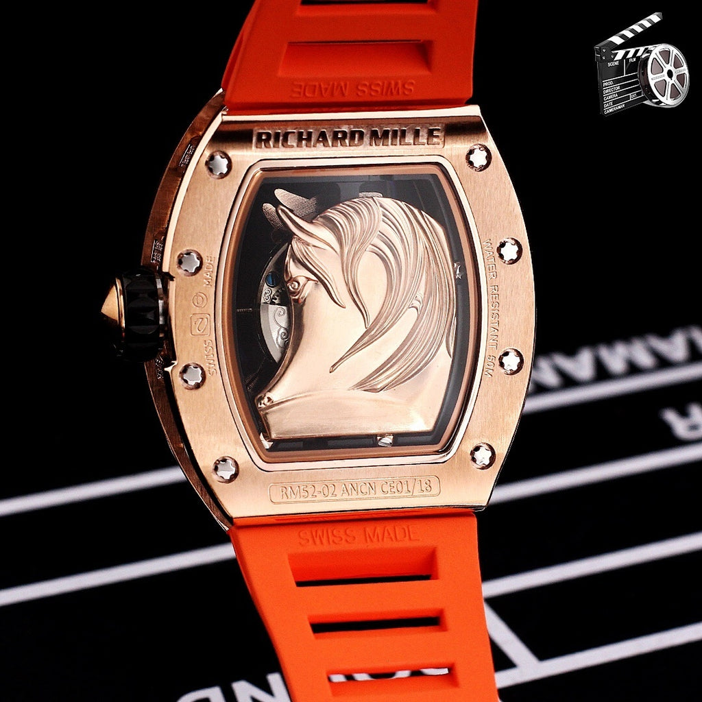 Richard Mille watch with orange rubber strap and rose-gold case with engraved portrait dial