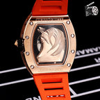 Richard Mille watch with orange rubber strap and rose-gold case with engraved portrait dial