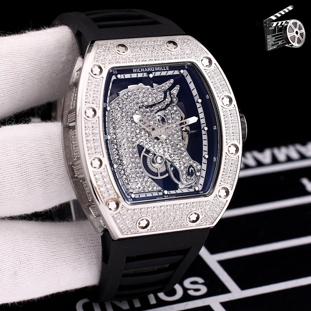 Richard Mille watch with diamond-set tonneau case, black rubber strap, blue skeleton dial